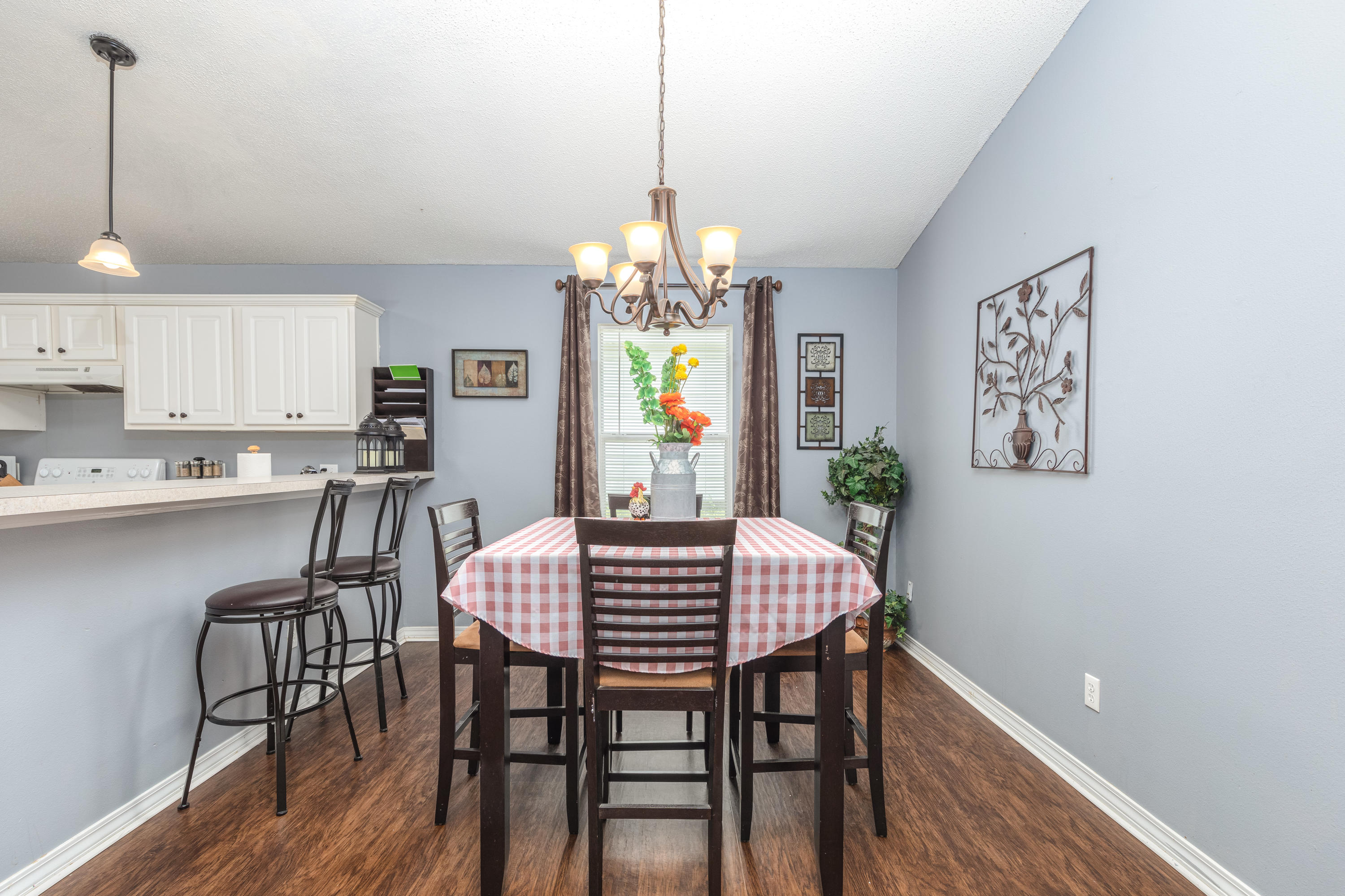 130 Sandstone Trail Crestview, FL 32539 - Photo 11 of 24 a view of a dining room with furniture window and wooden floor