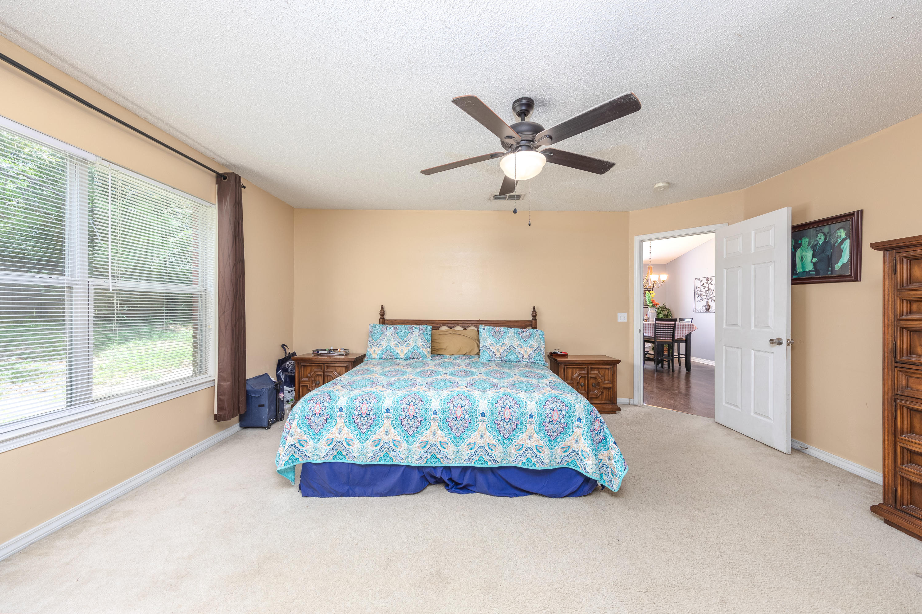 130 Sandstone Trail Crestview, FL 32539 - Photo 17 of 24 a bedroom with a large bed and a large window
