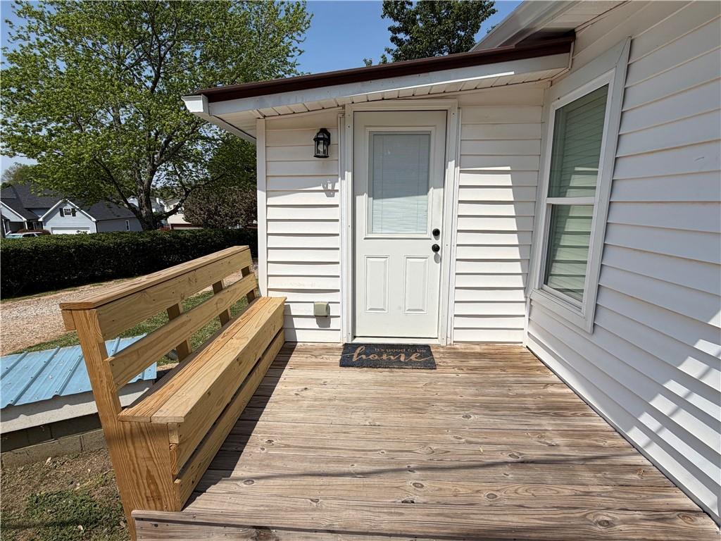 5919 River Road Flowery Branch, GA 30542 - Photo 4 of 18 a view of a balcony with wooden floor and fence