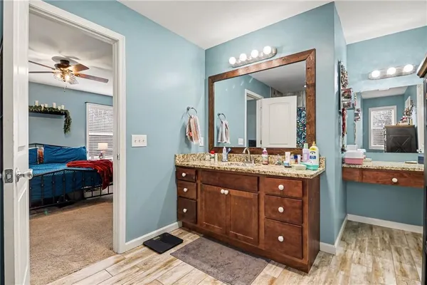 a en suite bathroom with a sink and a mirror