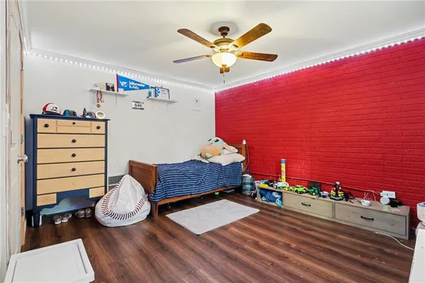 a room with furniture and a flat screen tv