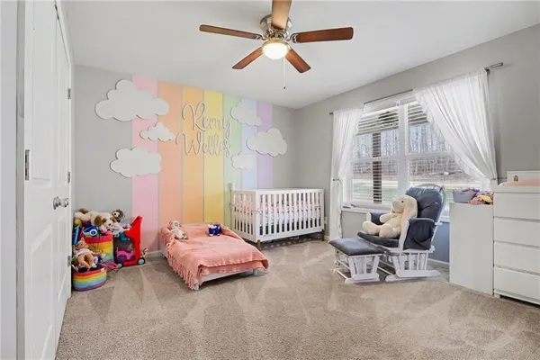 a bedroom with furniture and a window