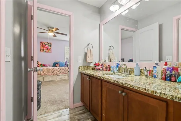 a bathroom with sink and mirror
