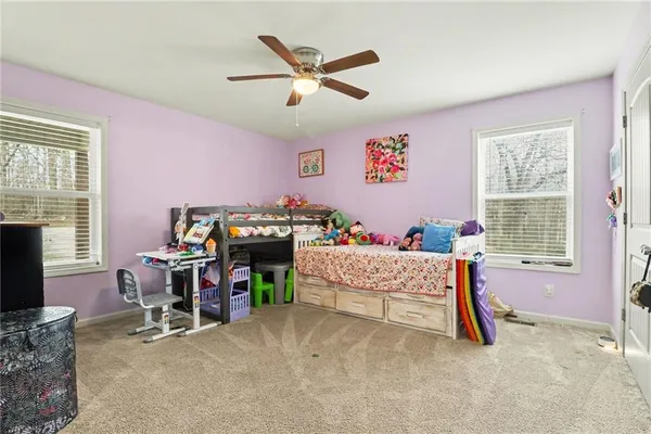 a bedroom with furniture and a window