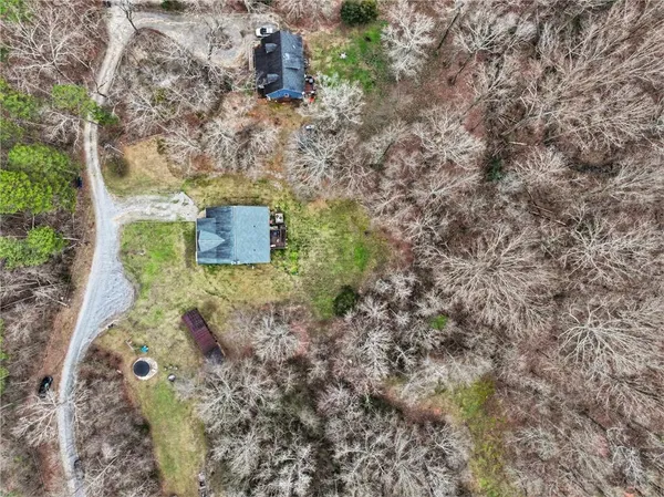 a aerial view of a house with a yard