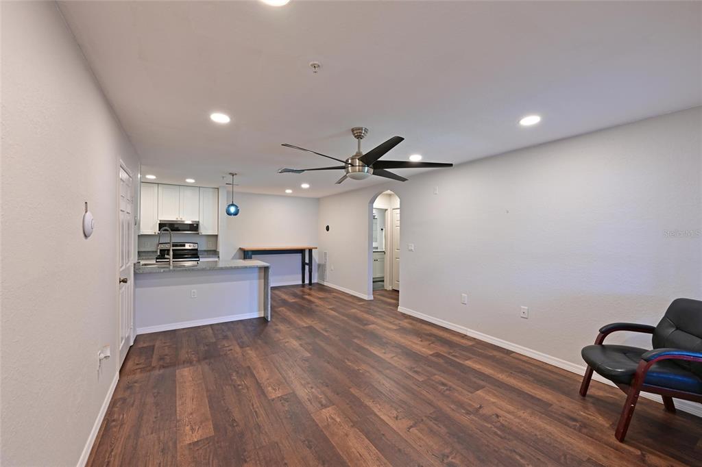 8809 Manor Loop, Unit 106 Lakewood Ranch, FL 34202 - Photo 11 of 40 a view of a kitchen with a sink and a refrigerator
