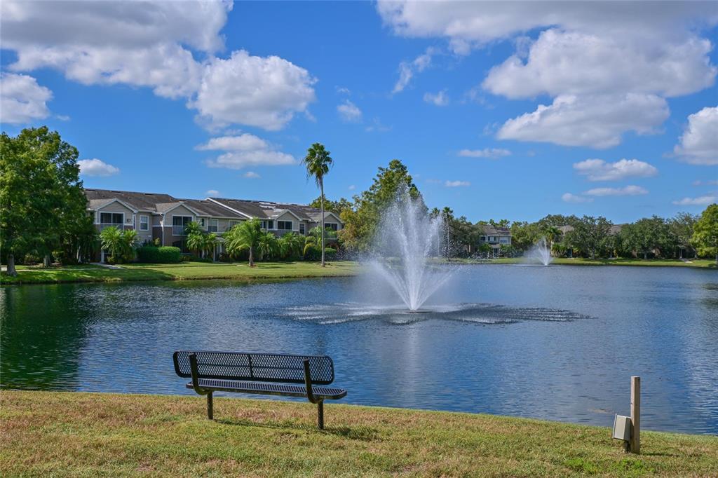 8809 Manor Loop, Unit 106 Lakewood Ranch, FL 34202 - Photo 2 of 40 a view of a lake in a garden