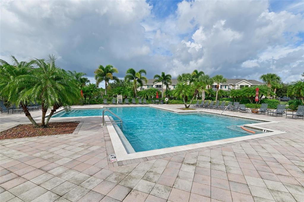 8809 Manor Loop, Unit 106 Lakewood Ranch, FL 34202 - Photo 30 of 40 a view of a yard and chair