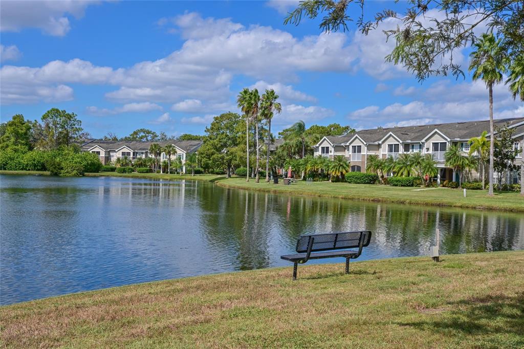 8809 Manor Loop, Unit 106 Lakewood Ranch, FL 34202 - Photo 3 of 40 a view of a lake with a lake in the background