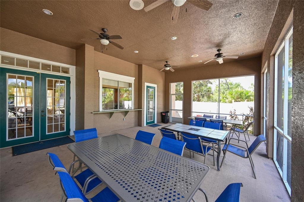 8809 Manor Loop, Unit 106 Lakewood Ranch, FL 34202 - Photo 34 of 40 a view of a dining room with furniture window and wooden floor
