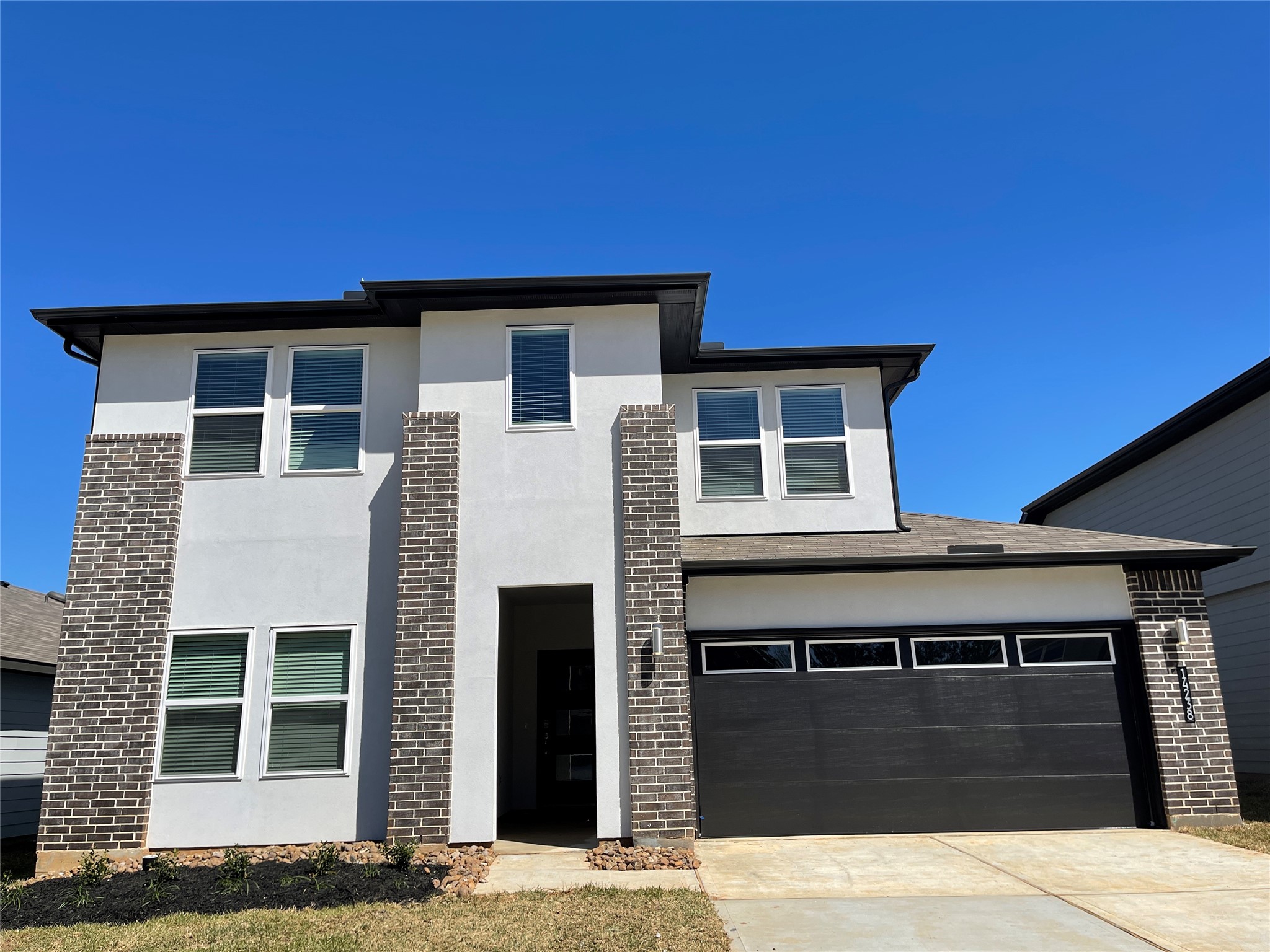 14238 Wonder Lake Lane Conroe, TX 77384 - Photo 1 of 20 a front view of a house with windows