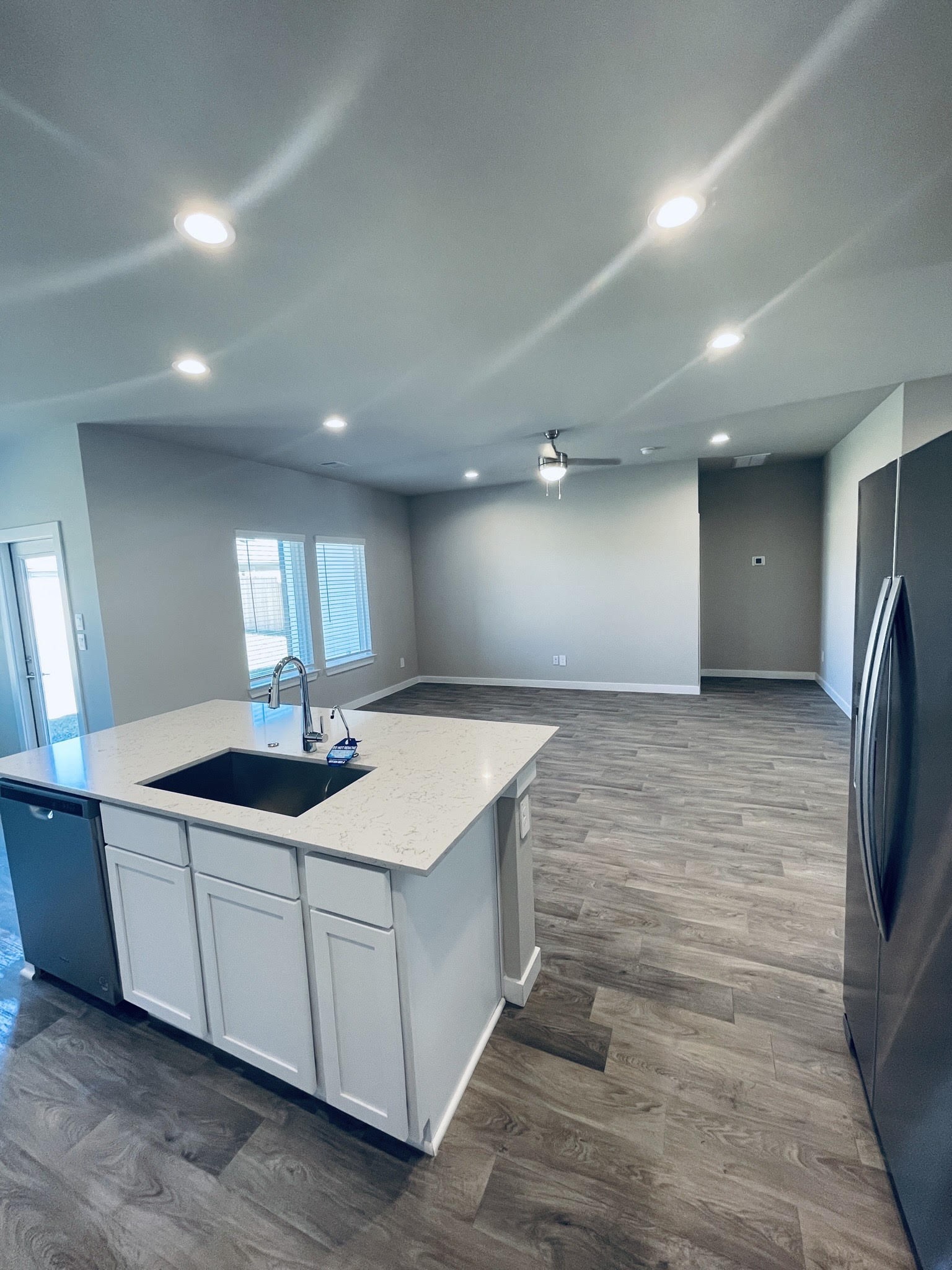 14238 Wonder Lake Lane Conroe, TX 77384 - Photo 5 of 20 a kitchen with stainless steel appliances kitchen island a sink and refrigerator