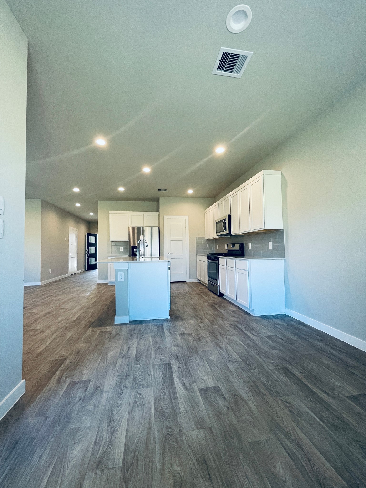 14238 Wonder Lake Lane Conroe, TX 77384 - Photo 8 of 20 a view of kitchen with cabinets and wooden floor