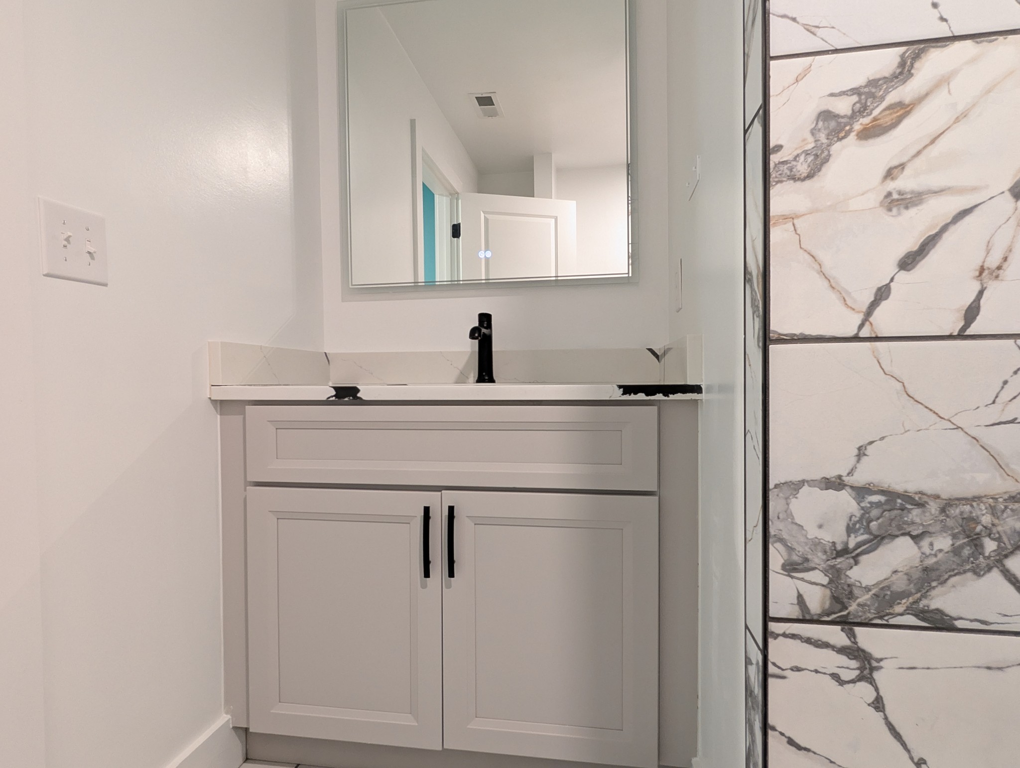 244 Warrior Road Madison, TN 37115 - Photo 16 of 24 a bathroom with a sink vanity and a mirror