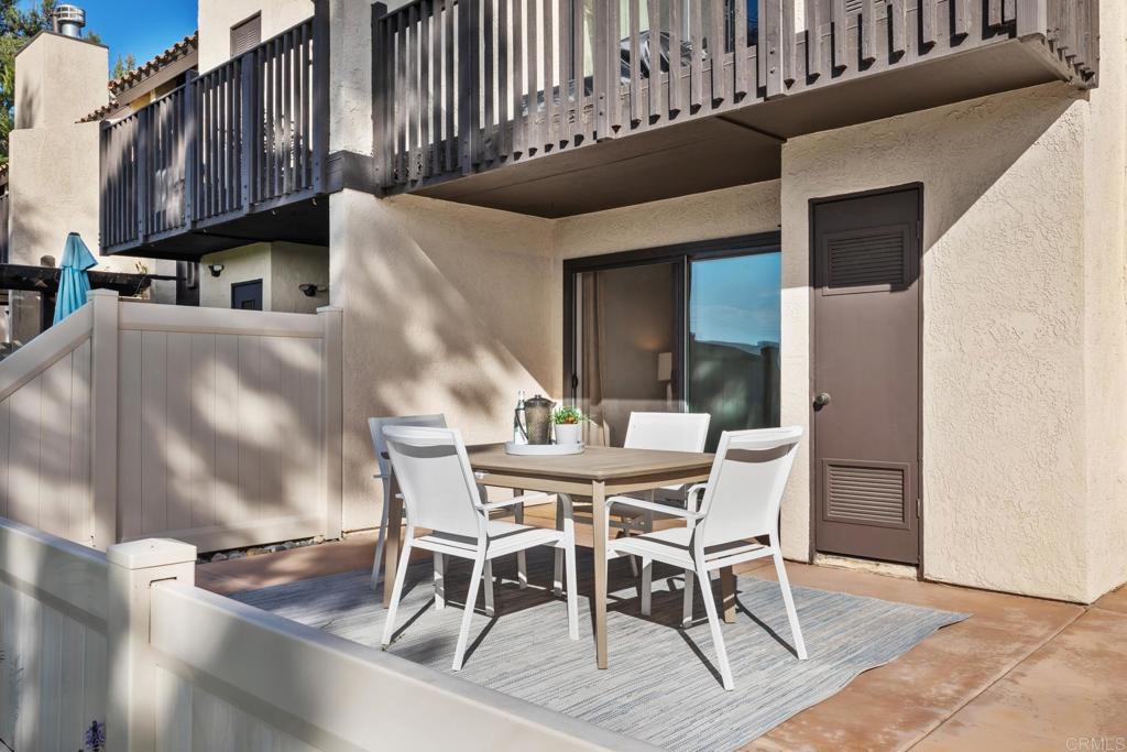 132 South Jayton Lane Encinitas, CA 92024 - Photo 16 of 37 a view of a dining table and chairs in the patio