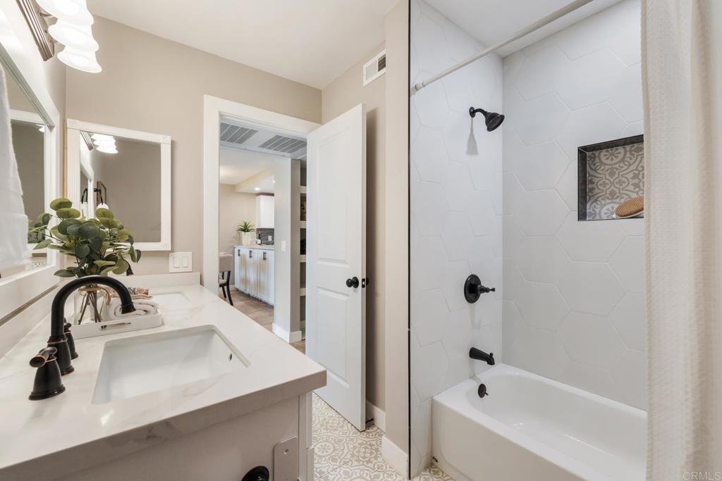 132 South Jayton Lane Encinitas, CA 92024 - Photo 21 of 37 a bathroom with a sink and a bathtub
