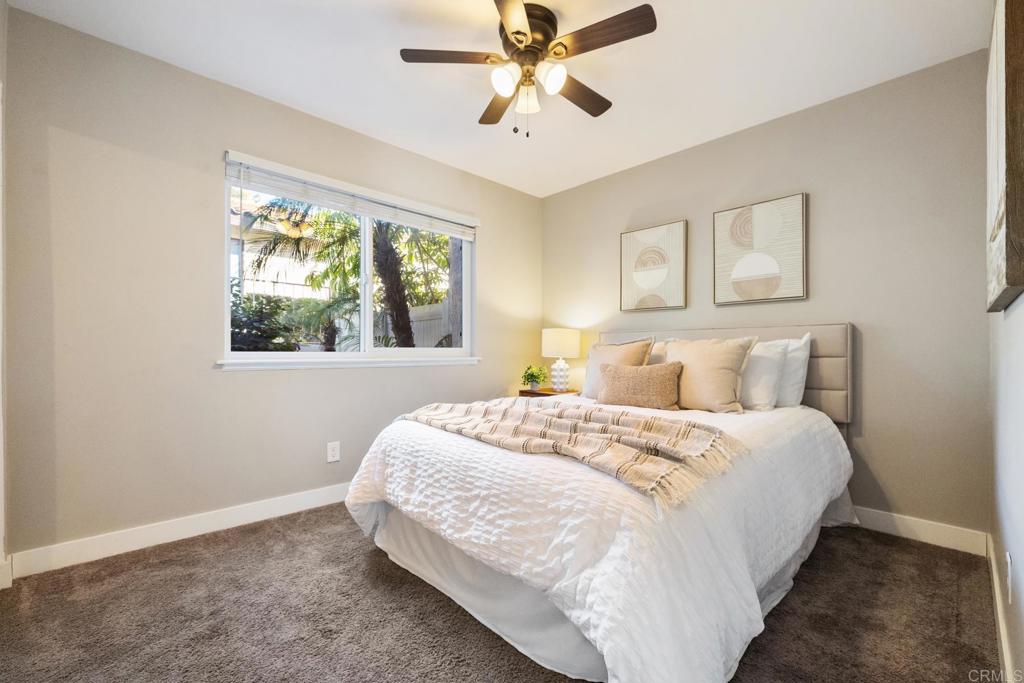 132 South Jayton Lane Encinitas, CA 92024 - Photo 22 of 37 a bedroom with bed and window