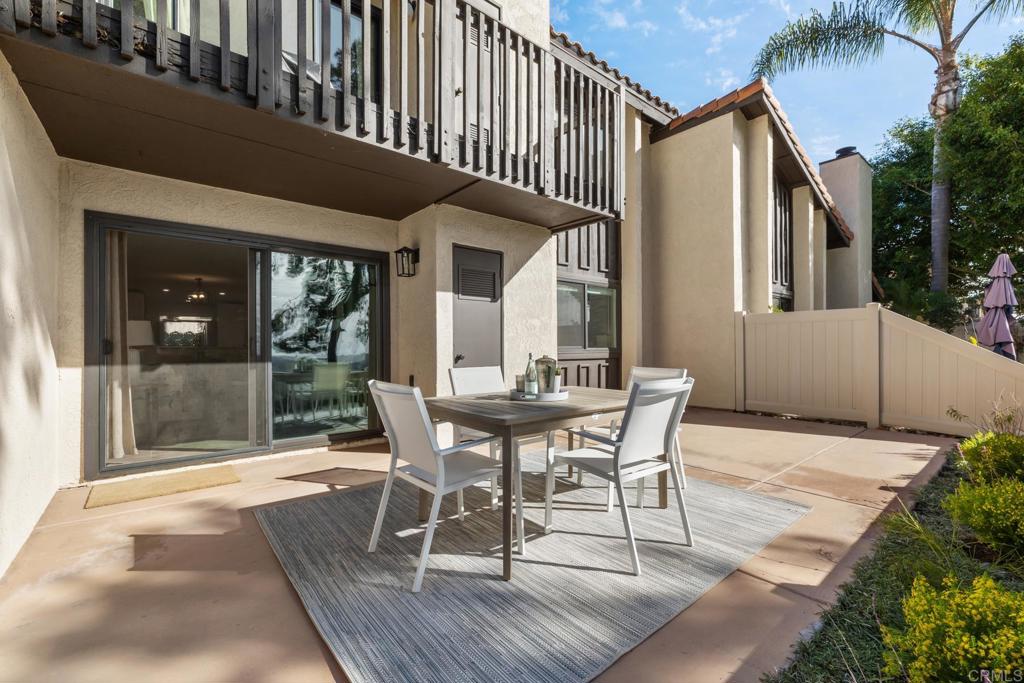 132 South Jayton Lane Encinitas, CA 92024 - Photo 25 of 37 a patio with table and chairs and potted plants