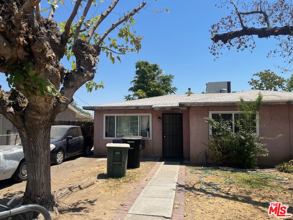 1605 Madison Street Bakersfield, CA 93307 - Photo 2 of 8 a view of a entryway door front of house