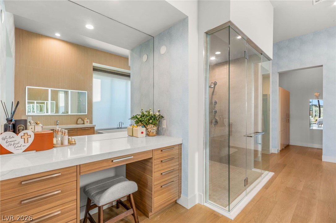 571 Overlook Rim Drive Henderson, NV 89012 - Photo 29 of 85 Full bath featuring a stall shower, light wood finished floors, vanity, and recessed lighting