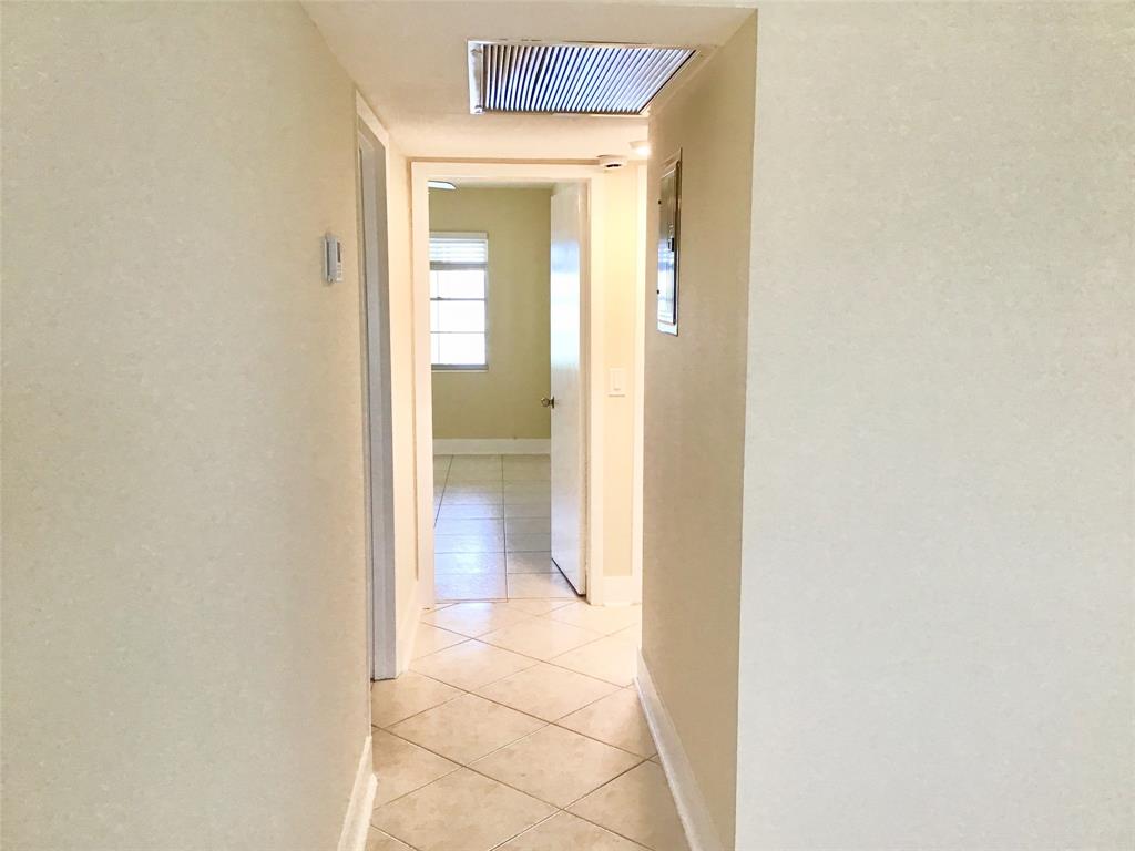 3032 Exeter, Unit 3032 Boca Raton, FL 33434 - Photo 14 of 32 a bathroom with a glass shower door