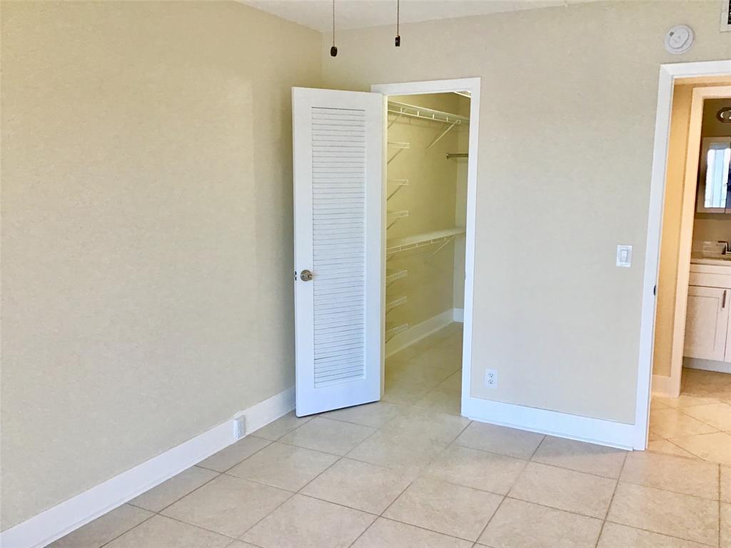 3032 Exeter, Unit 3032 Boca Raton, FL 33434 - Photo 16 of 32 an empty room with a door