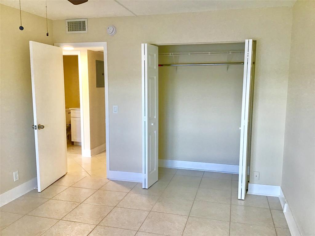 3032 Exeter, Unit 3032 Boca Raton, FL 33434 - Photo 18 of 32 a view of entryway with white walls and door