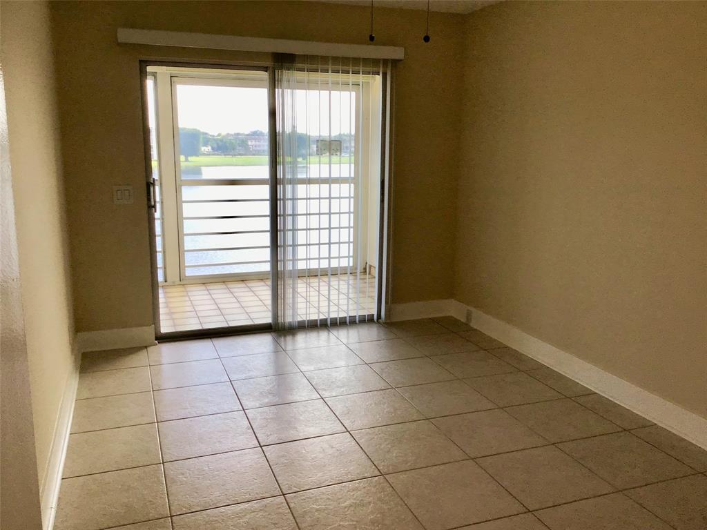 3032 Exeter, Unit 3032 Boca Raton, FL 33434 - Photo 19 of 32 a view of an empty room with a window