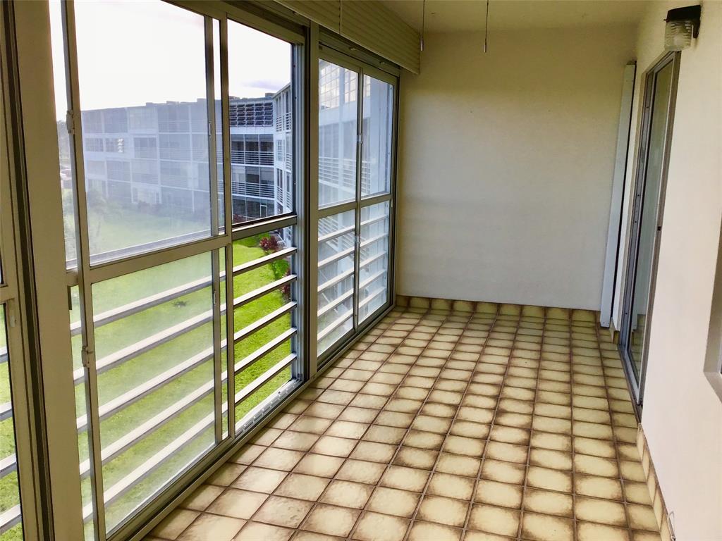 3032 Exeter, Unit 3032 Boca Raton, FL 33434 - Photo 21 of 32 a view of empty room with windows