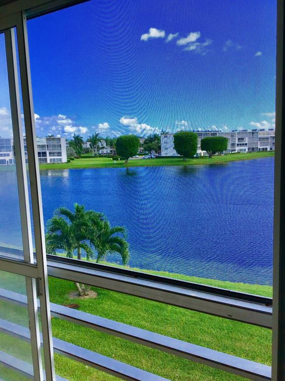3032 Exeter, Unit 3032 Boca Raton, FL 33434 - Photo 24 of 32 a view of a yard with a lake view
