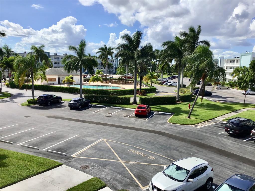 3032 Exeter, Unit 3032 Boca Raton, FL 33434 - Photo 32 of 32 a view of a street with a cars park side of a street