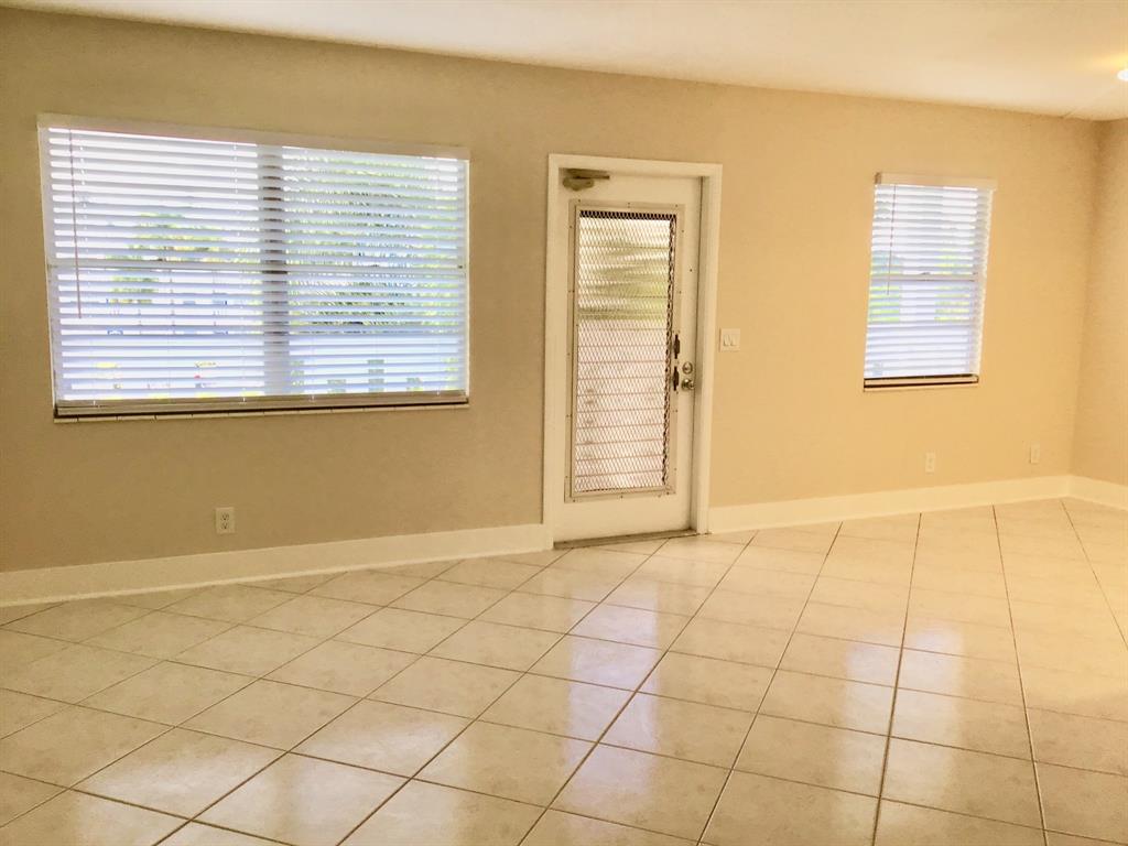 3032 Exeter, Unit 3032 Boca Raton, FL 33434 - Photo 8 of 32 a view of an empty room with a window