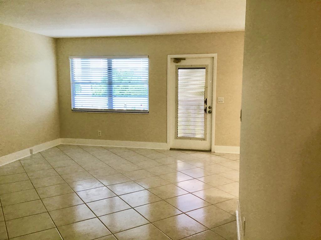 3032 Exeter, Unit 3032 Boca Raton, FL 33434 - Photo 9 of 32 an empty room with windows