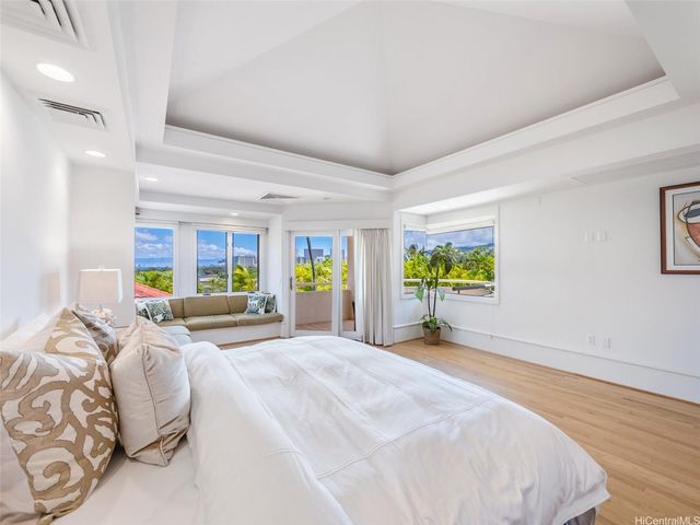 a bedroom with a bed and a couch