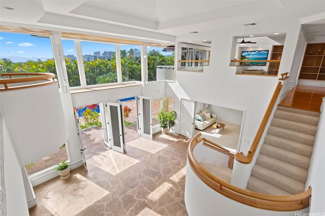 view of living room with furniture and floor to ceiling window