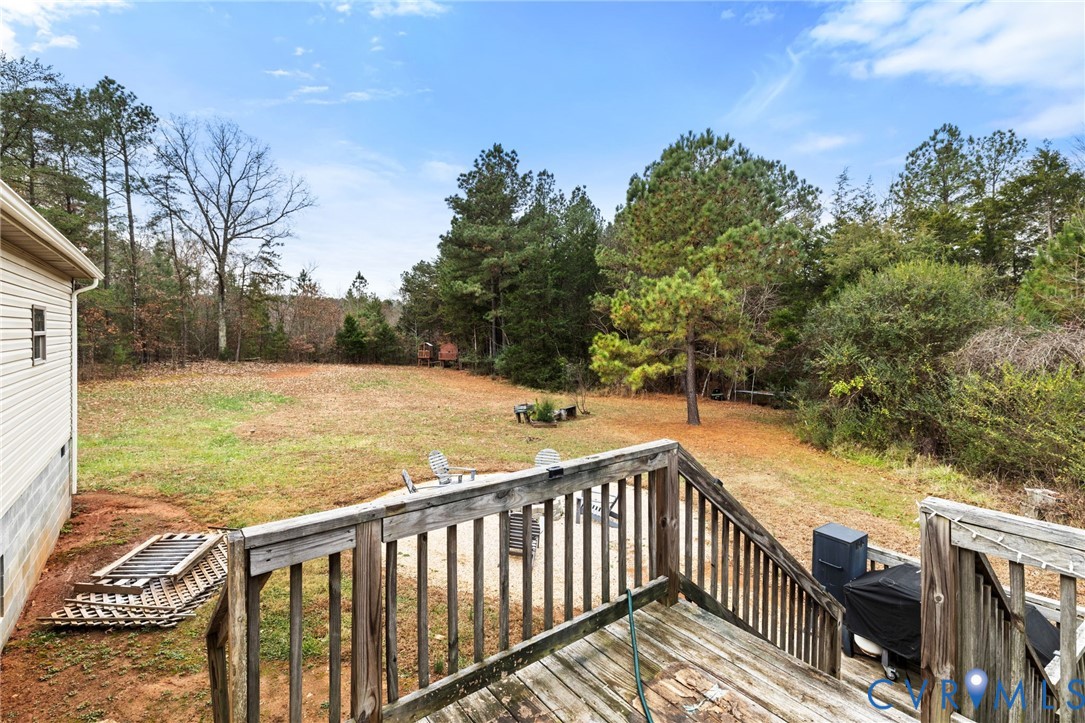 11391 Watkins Road Rockville, VA 23146 - Photo 25 of 28 a view of a balcony with wooden floor and fence