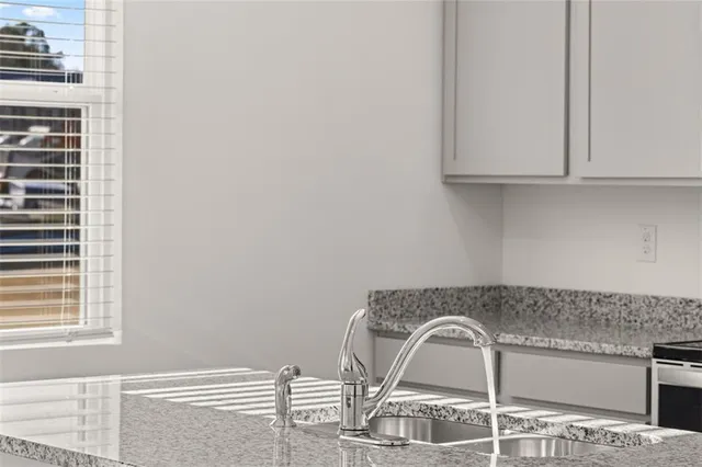 a close view of a sink and a window