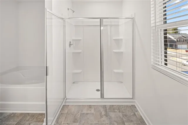 a bathroom with a glass shower door