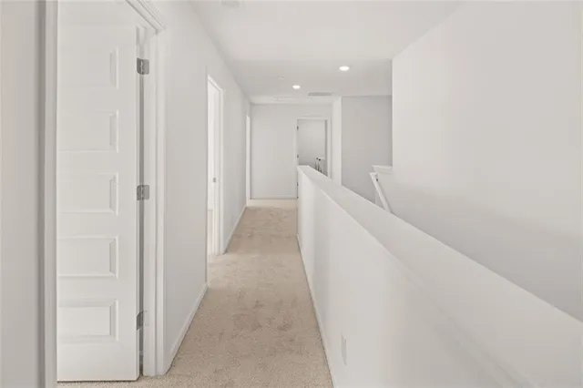 a view of a hallway with white walls