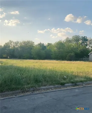 a view of a lake and a yard