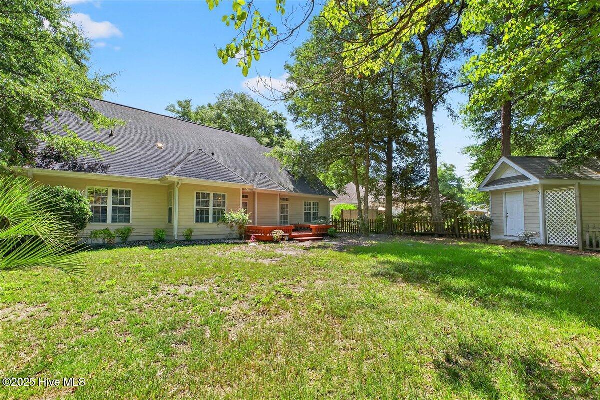 8985 Woodbine Road Southwest Sunset Beach, NC 28468 - Photo 56 of 65 View of spacious backyard