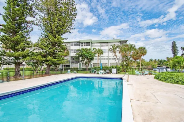 a view of swimming pool with a yard