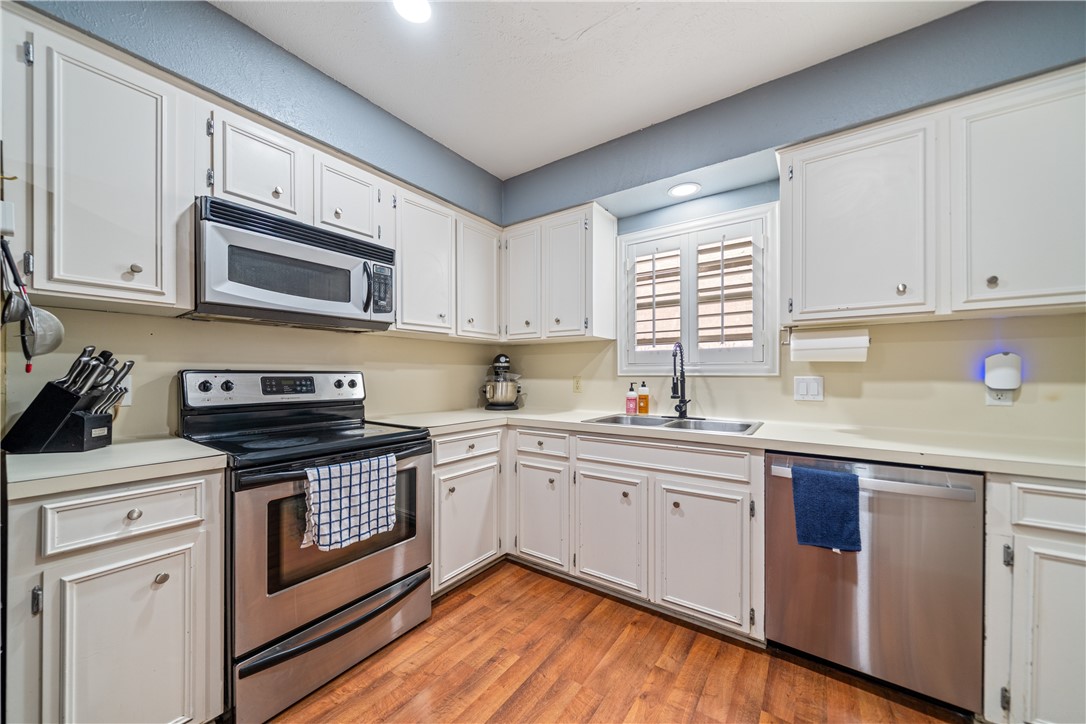 2217 Post Oak Drive Portland, TX 78374 - Photo 12 of 39 a kitchen with granite countertop cabinets stainless steel appliances and a sink