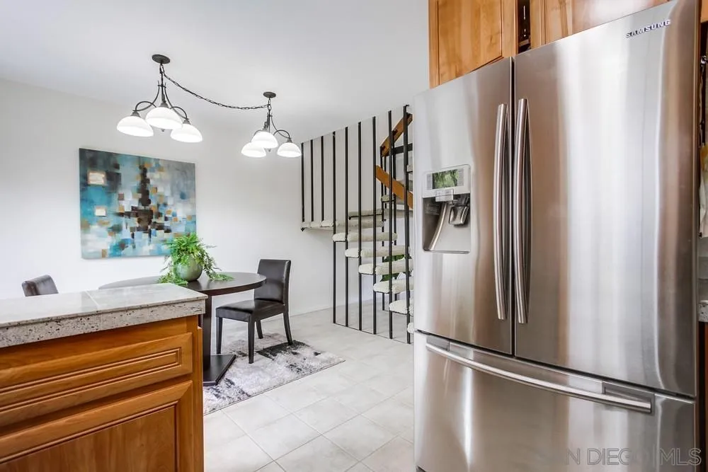 8918 Fletcher Valley Dr. Santee, CA 92071 - Photo 14 of 31 a kitchen with stainless steel appliances granite countertop a refrigerator and a stove