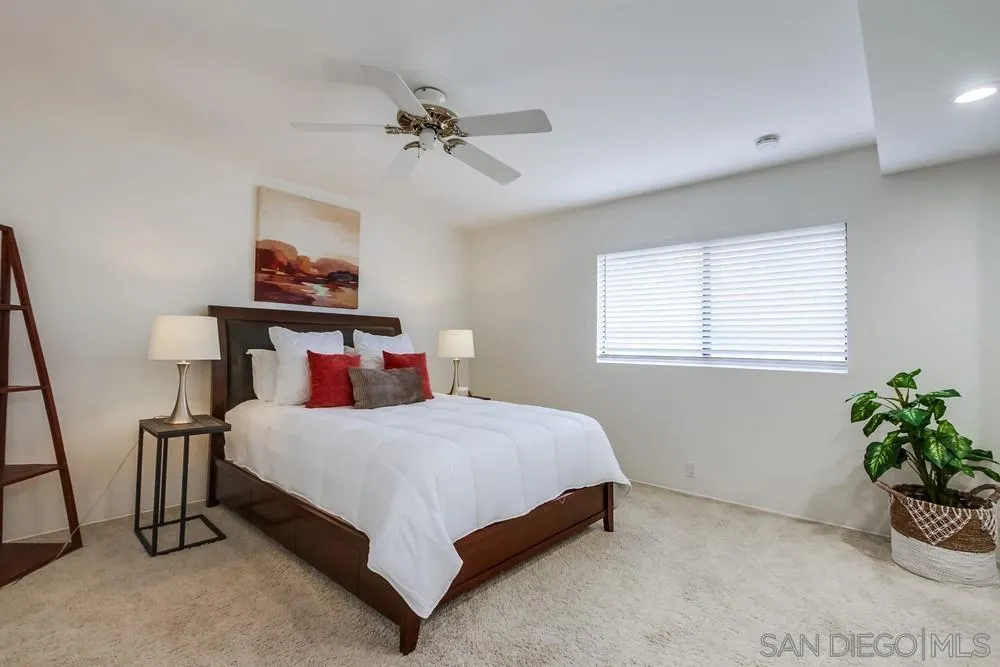 8918 Fletcher Valley Dr. Santee, CA 92071 - Photo 17 of 31 a bedroom with a bed and a painting on the wall