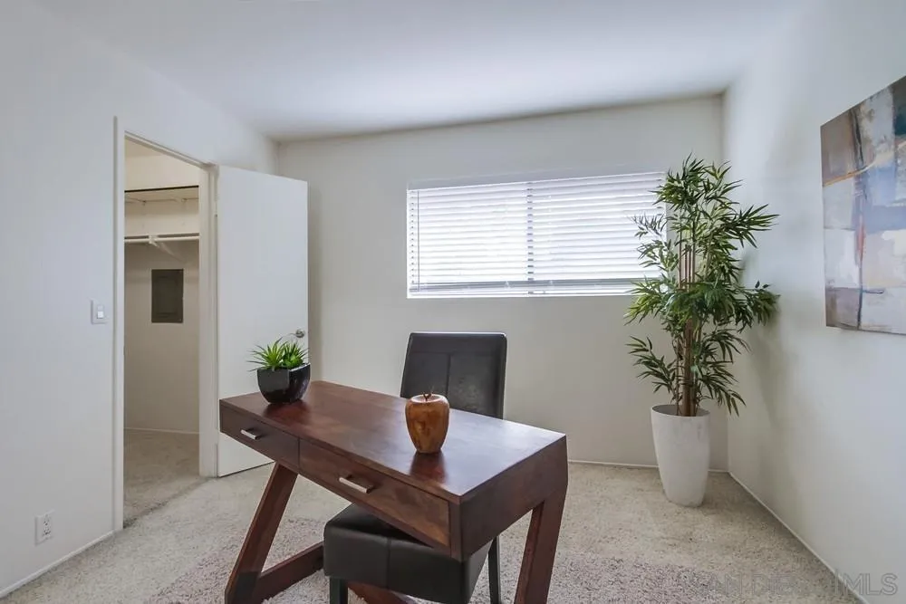 8918 Fletcher Valley Dr. Santee, CA 92071 - Photo 23 of 31 a view of a workspace with a table and chair in a room
