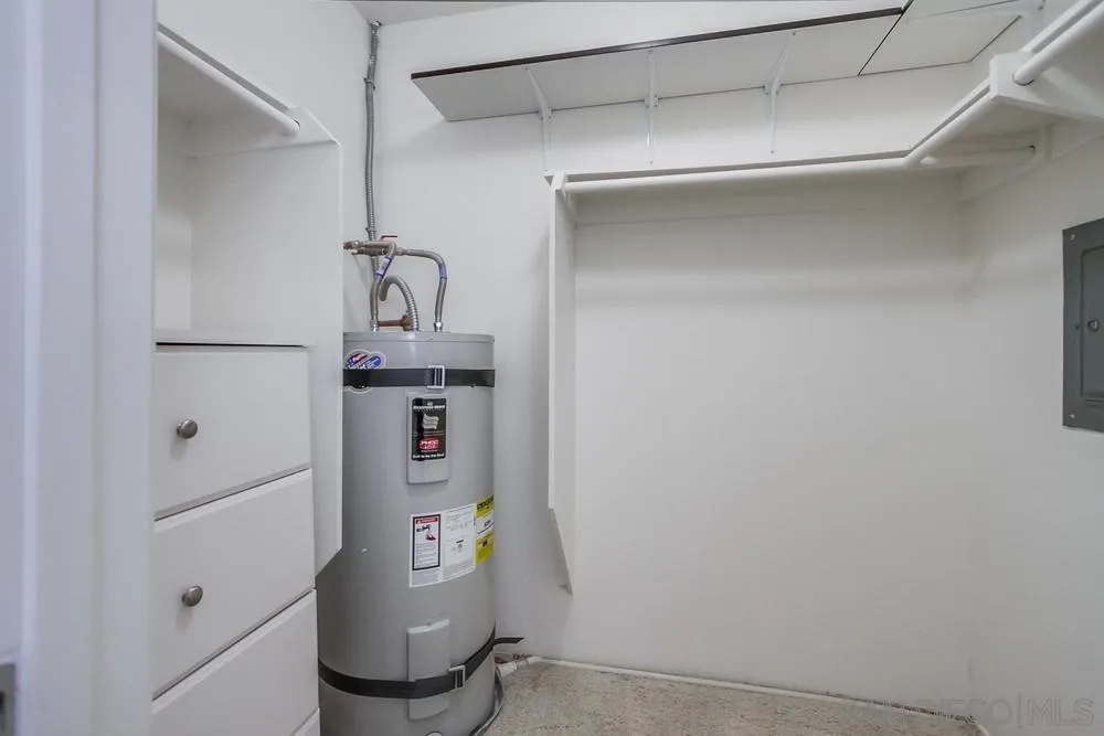 8918 Fletcher Valley Dr. Santee, CA 92071 - Photo 25 of 31 a room with a refrigerator and washer