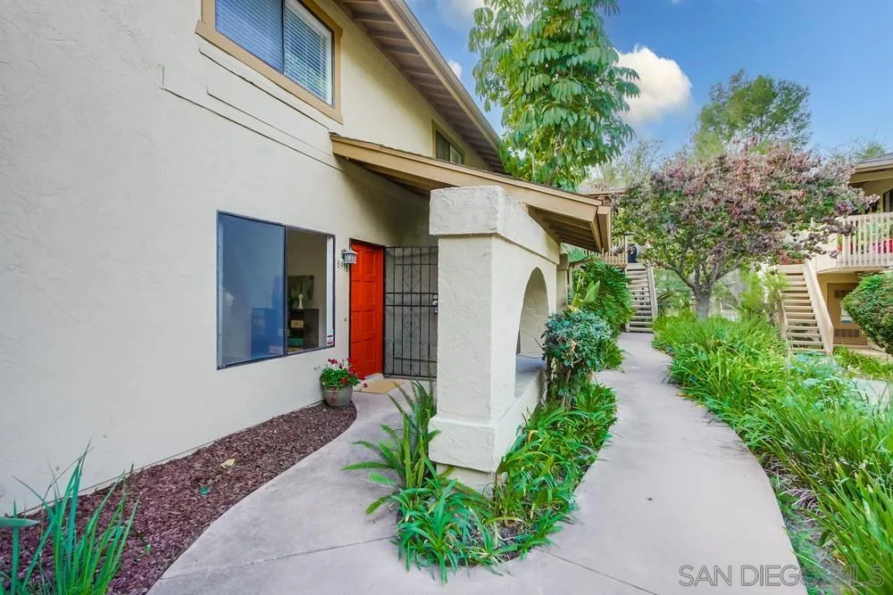 8918 Fletcher Valley Dr. Santee, CA 92071 - Photo 3 of 31 a front view of a house with garden