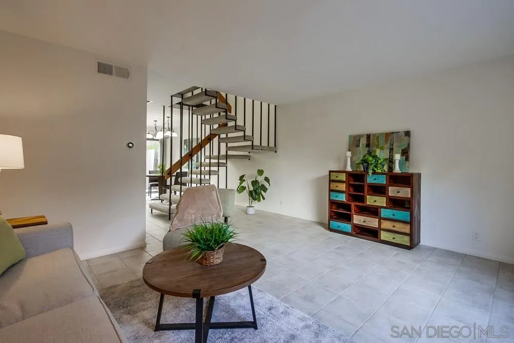 8918 Fletcher Valley Dr. Santee, CA 92071 - Photo 6 of 31 a living room with furniture and a potted plants