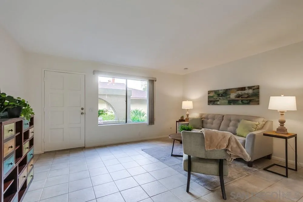 8918 Fletcher Valley Dr. Santee, CA 92071 - Photo 7 of 31 a living room with furniture and a large window